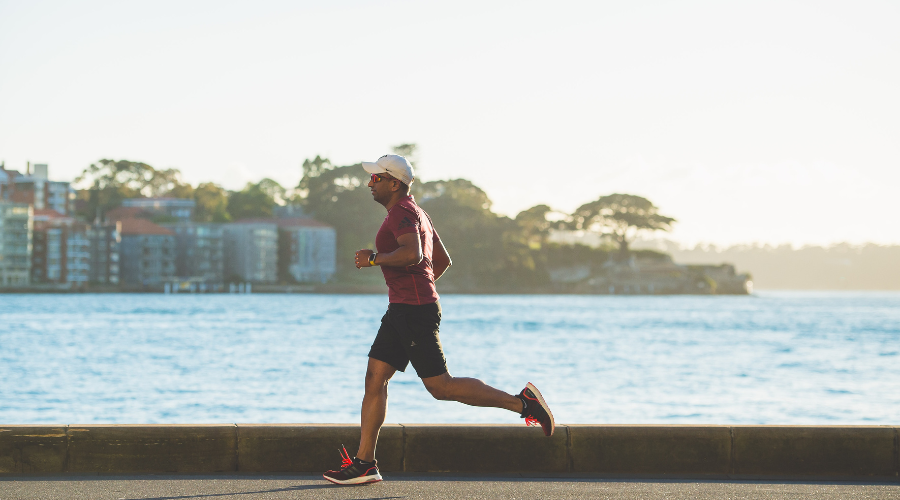 Man running next to river